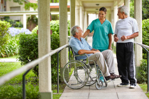 Nurse Outside with 2 Elderly Patients