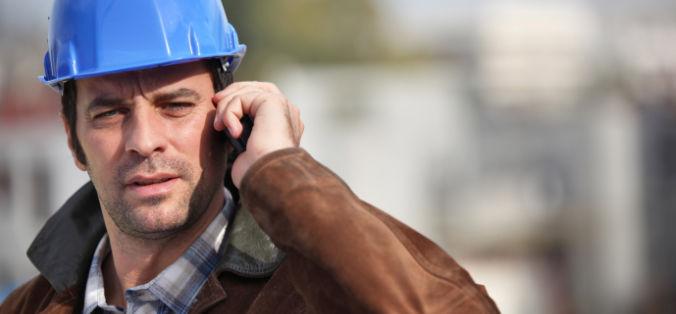 Construction worker in a hardhat on the phone