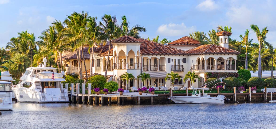 Luxury Florida waterfront home with docked boats.